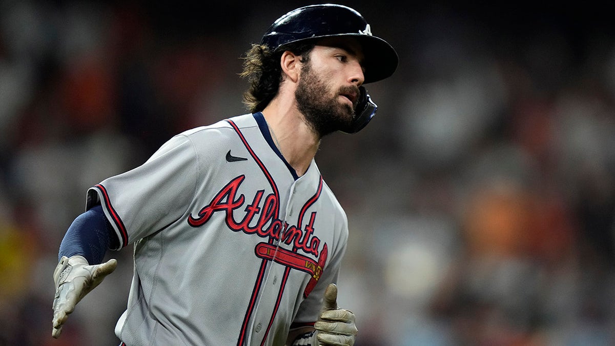 Atlanta Braves' Dansby Swanson celebrates a two-run home run during the fifth inning in Game 6 of baseball's World Series between the Houston Astros and the Atlanta Braves Tuesday, Nov. 2, 2021, in Houston.