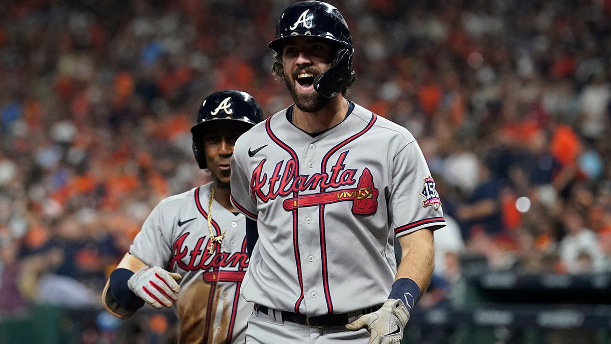 Atlanta Braves' Dansby Swanson celebrates a two-run home run during the fifth inning in Game 6 of baseball's World Series between the Houston Astros and the Atlanta Braves Tuesday, Nov. 2, 2021, in Houston.