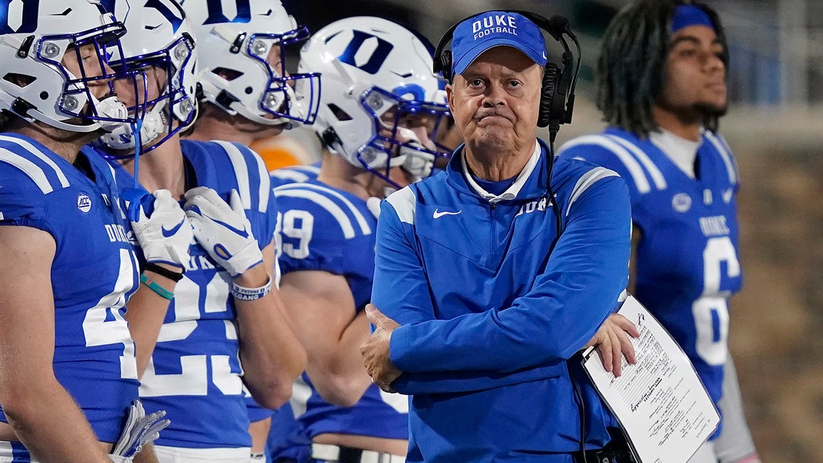 Duke head coach David Cutcliffe walks the sidelines during the second half of an NCAA college football game against Louisville in Durham, N.C., Thursday, Nov. 18, 2021. 