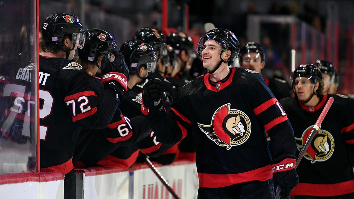 Ottawa Senators' Drake Batherson (19) celebrates with Thomas Chabot (72) after scoring against the Pittsburgh Penguins during the third period of an NHL hockey game in Ottawa, on Saturday, Nov. 13, 2021. 