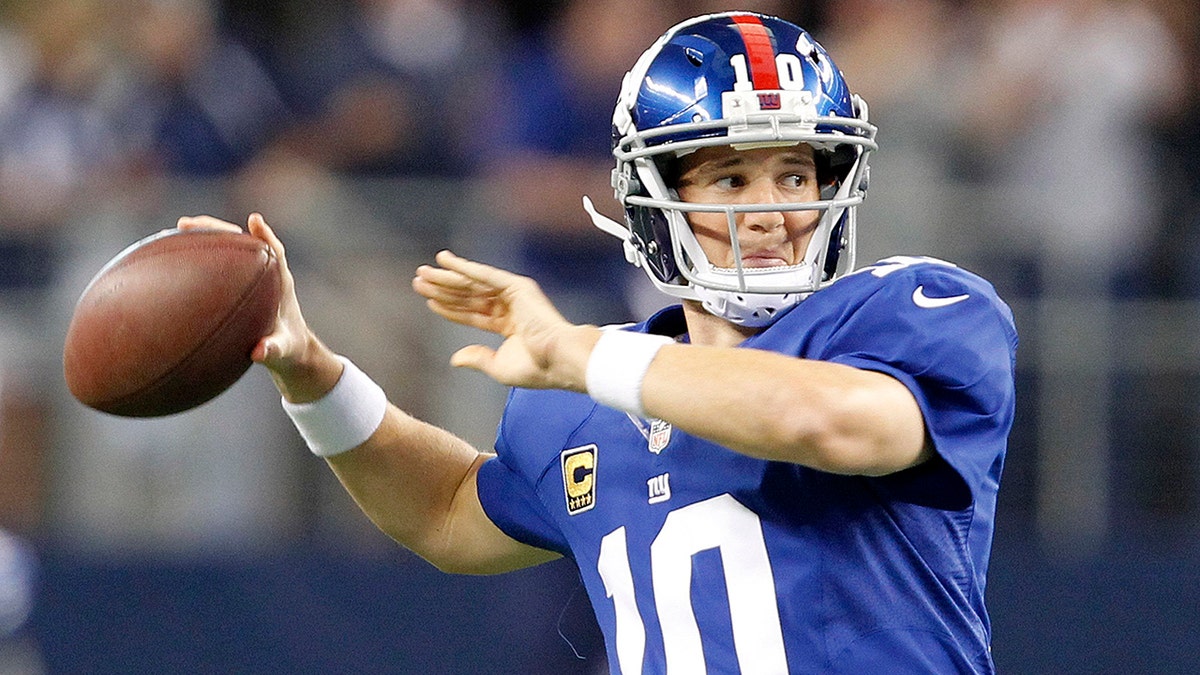 Giants quarterback Eli Manning warms up as the New York Giants face the Dallas Cowboys at AT&amp;T Stadium in Arlington, Texas, on Sunday, September 8, 2013.