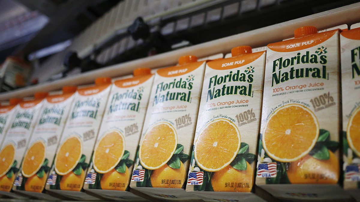 Freshly-filled cartons of orange juice move down a production line at Florida's Natural Growers plant in Lake Wales, Florida, U.S., on Thursday, May 26, 2016. Luke Sharrett/Bloomberg via Getty Images