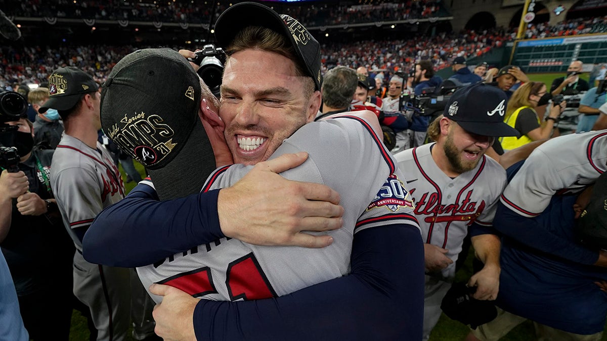 Atlanta Braves relief pitcher Will Smith and first baseman Freddie Freeman celebrate after winning baseball's World Series in Game 6 against the Houston Astros Tuesday, Nov. 2, 2021, in Houston. The Braves won 7-0.