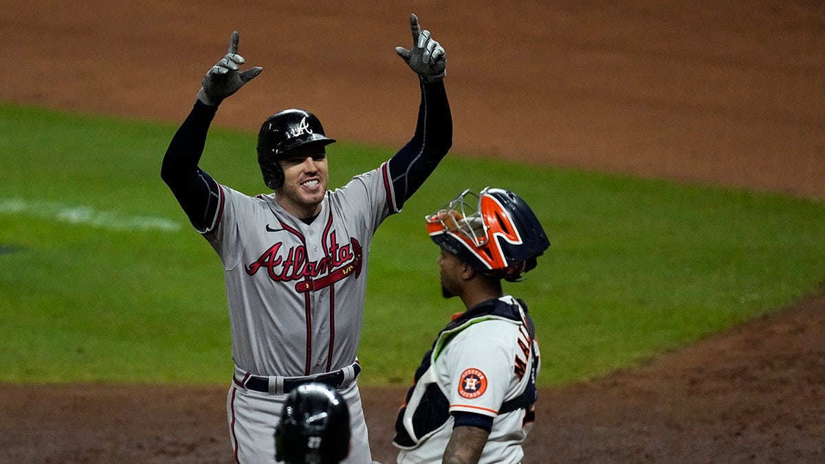 Atlanta Braves' Freddie Freeman celebrates after a home run during the seventh inning in Game 6 of baseball's World Series between the Houston Astros and the Atlanta Braves Tuesday, Nov. 2, 2021, in Houston.