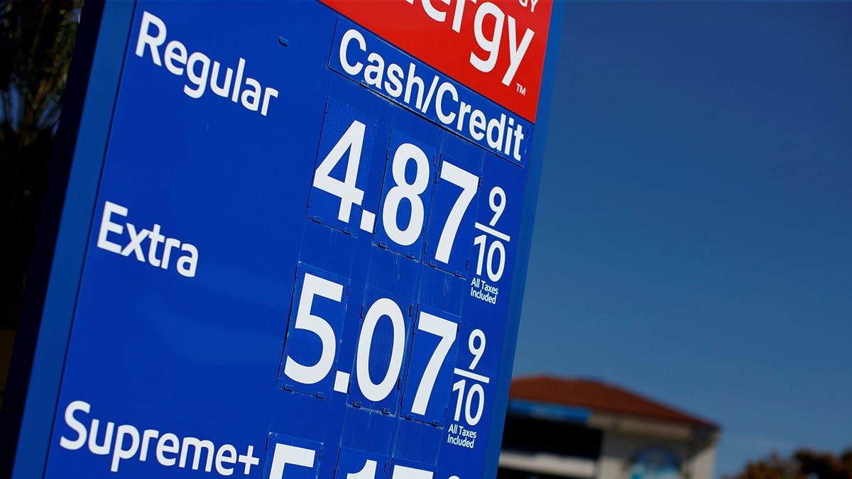 Gas prices grow along with inflation as this sign at a gas station shows in San Diego, California, Nov. 9, 2021.