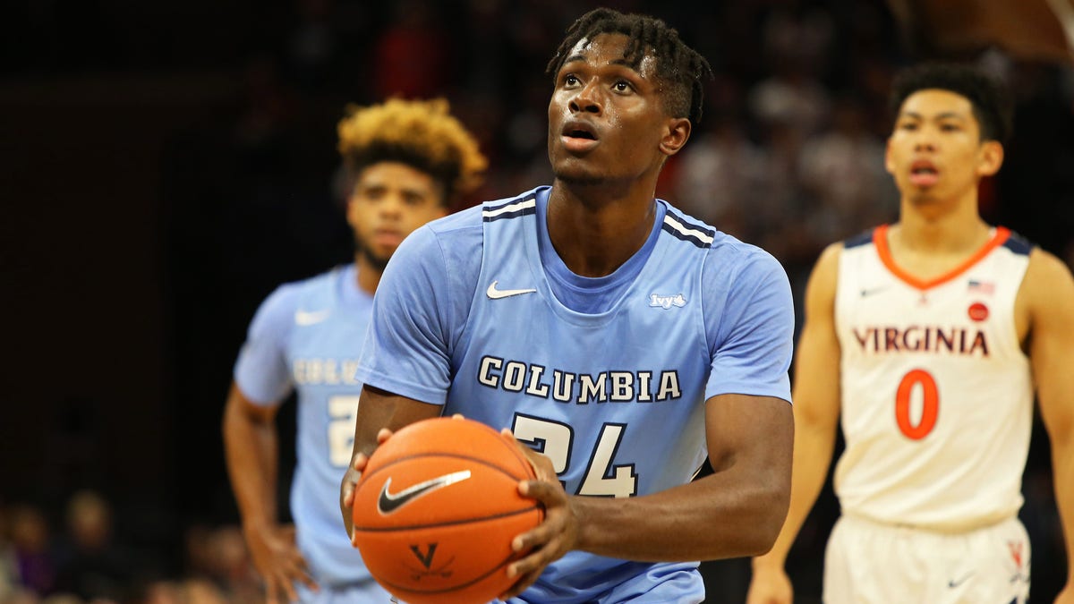 CHARLOTTESVILLE, VA - NOVEMBER 16: Ike Nweke #24 of the Columbia Lions shoots a free throw in the first half during a game against the Virginia Cavaliers at John Paul Jones Arena on November 16, 2019 in Charlottesville, Virginia. (Photo by Ryan M. Kelly/Getty Images)