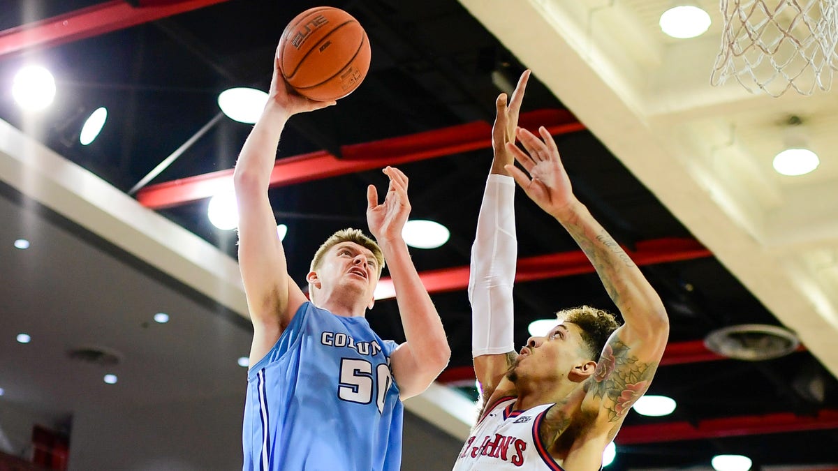 NEW YORK, NEW YORK - NOVEMBER 20:  Joseph Smoyer #50 of the Columbia Lions attempts a shot against Damien Sears #15 of the St. John's Red Storm at Carnesecca Arena on November 20, 2019 in New York City. (Photo by Steven Ryan/Getty Images)
