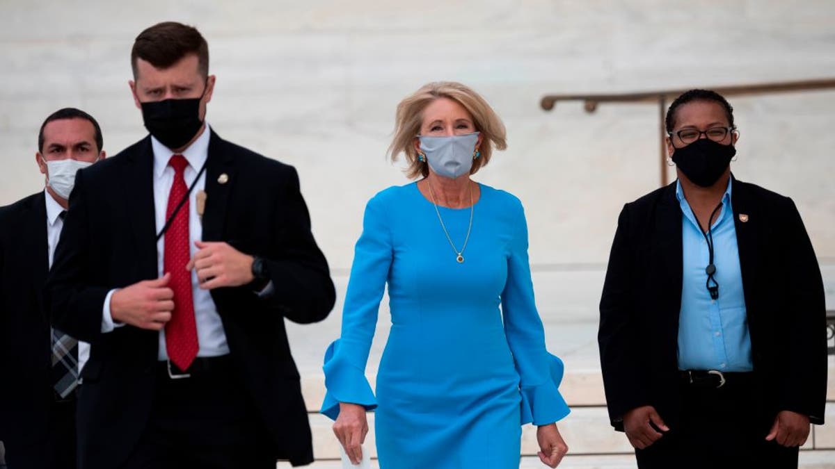 Secretary of Education Betsy DeVos arrives to pay her respects as Justice Ruth Bader Ginsburg lies in repose in front of the U.S. Supreme Court in Washington, D.C., on Sept. 24, 2020. (Photo by ANDREW CABALLERO-REYNOLDS / AFP) 