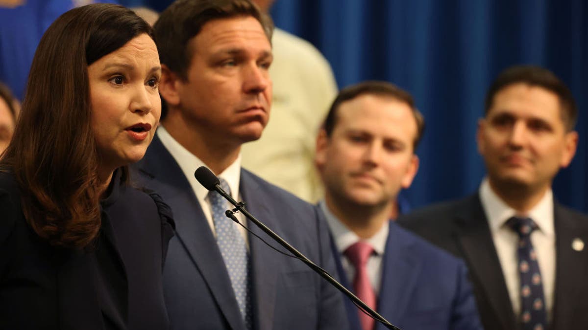 Florida Attorney General Ashley Moody and Florida Gov. Ron DeSantis at a news conference on April 19, 2021.