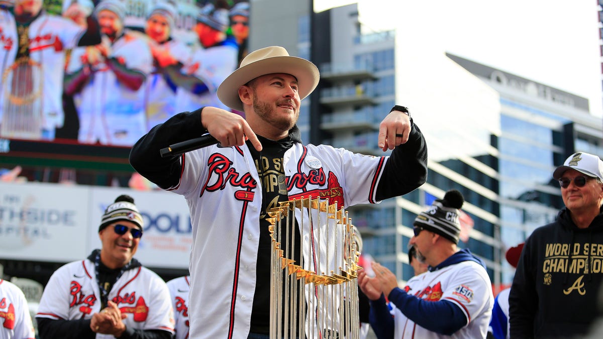 Tyler Matzek of the Atlanta Braves with the Commissioner's Trophy during the World Series celebration at Truist Park Nov. 5, 2021 in Atlanta.  