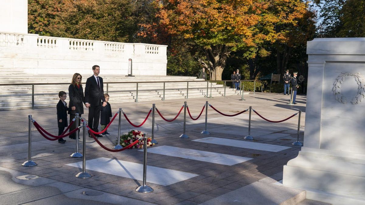 Sen. Tom Cotton, R-Ark., and his family, stand after placing flowers during a centennial commemoration event at the Tomb of the Unknown Soldier in Arlington National Cemetery on Nov. 9, 2021, in Arlington, Virginia. 