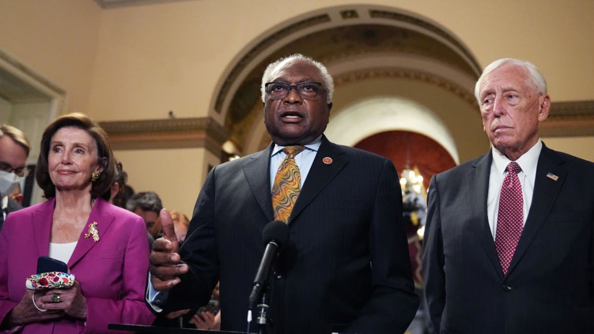House Majority Whip Jim Clyburn, Speaker of the House Nancy Pelosi, and House Majority Leader Steny Hoyer, conduct a news conference at the Capitol on Nov. 5, 2021. (Tom Williams/CQ-Roll Call, Inc via Getty Images)