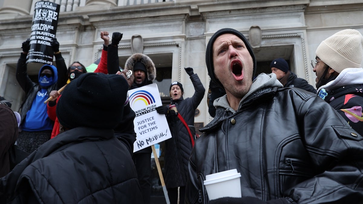 BLM protesters and Kyle Rittenhouse supporters continue to demonstrate outside of the Kenosha County Courthouse on the third day in the trial of Kyle Rittenhouse on November 18, 2021 in Kenosha, Wisconsin, United States. (Photo by Tayfun Coskun/Anadolu Agency via Getty Images)