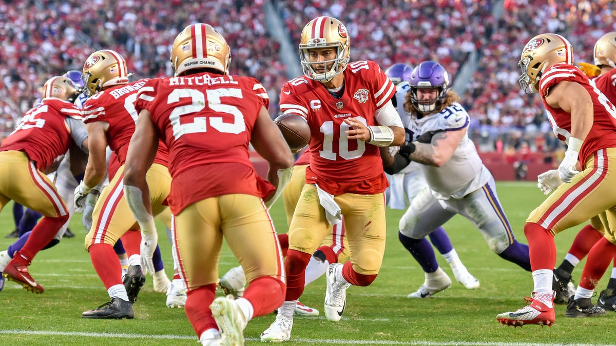 San Francisco 49ers quarterback Jimmy Garoppolo (10) hands the ball off to San Francisco 49ers running back Eli Mitchell (25) in the end zone during the game between the Minnesota Vikings and the San Francisco 49ers on Sunday, Nov. 28, 2021 at Levi's Stadium in Santa Clara, California. 