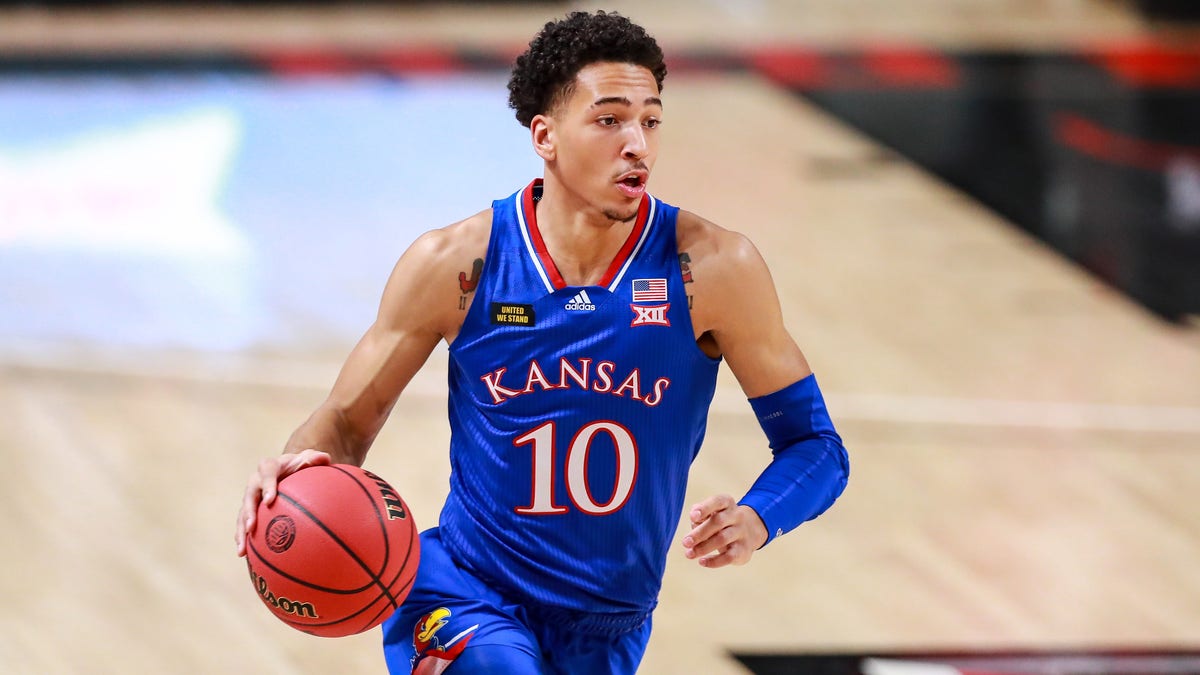 LUBBOCK, TEXAS - DECEMBER 17: Forward Jalen Wilson #10 of the Kansas Jayhawks handles the ball during the first half of the college basketball game against the Texas Tech Red Raiders at United Supermarkets Arena on December 17, 2020 in Lubbock, Texas. (Photo by John E. Moore III/Getty Images)