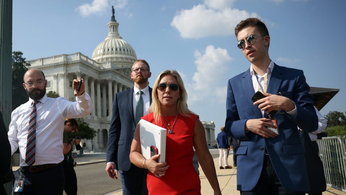 Rep. Marjorie Taylor Greene, R-Ga., leaves a news conference on the infrastructure bill, outside the Capitol Building on Aug. 23, 2021 in Washington, D.C. Greene, along with fellow members of the House Freedom Caucus, criticized the bill for being too expensive and supporting special interests.