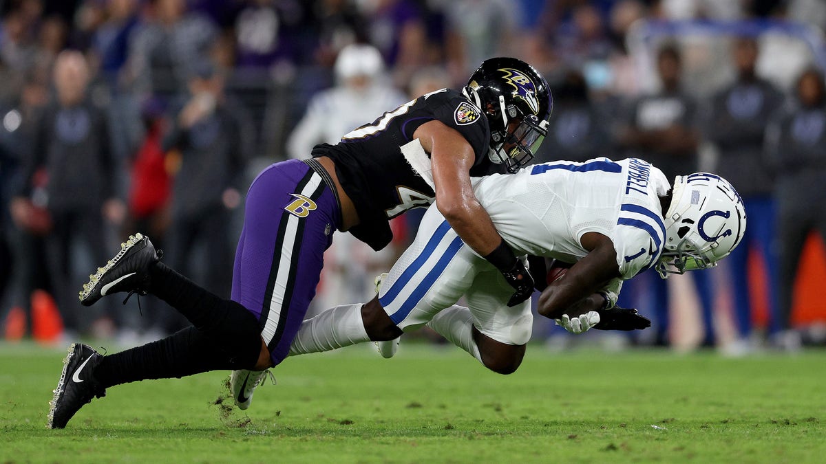 BALTIMORE, MARYLAND - OCTOBER 11: Parris Campbell #1 of the Indianapolis Colts is tackled by Malik Harrison #40 of the Baltimore Ravens during the first quarter in a game  at M&amp;amp;T Bank Stadium on October 11, 2021 in Baltimore, Maryland. (Photo by Patrick Smith/Getty Images)