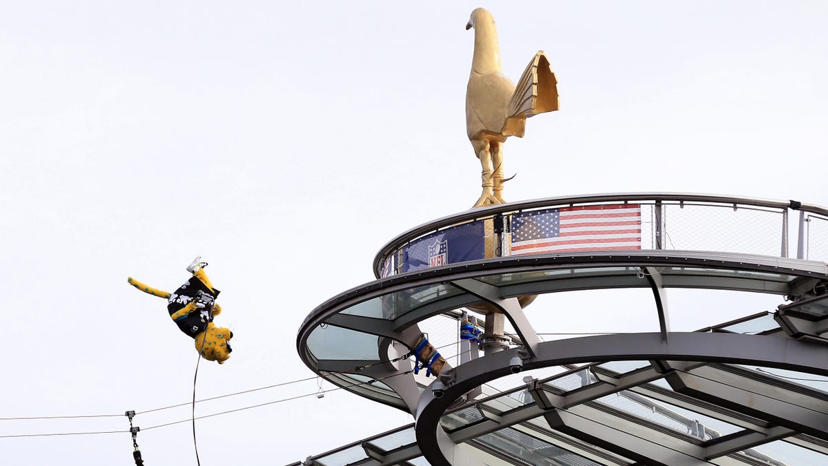 The Jacksonville Jaguars' mascot Jaxson de Ville jumps off the roof of the stadium during the NFL London 2021 match against the Miami Dolphins on Oct. 17, 2021, in England. 