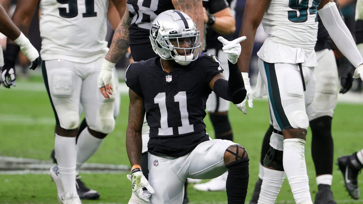 LAS VEGAS, NEVADA - OCTOBER 24:  Wide receiver Henry Ruggs III #11 of the Las Vegas Raiders spins the ball on the ground and gestures as he celebrates a catch for a first down against the Philadelphia Eagles during their game at Allegiant Stadium on October 24, 2021 in Las Vegas, Nevada. The Raiders defeated the Eagles 33-22.  (Photo by Ethan Miller/Getty Images)