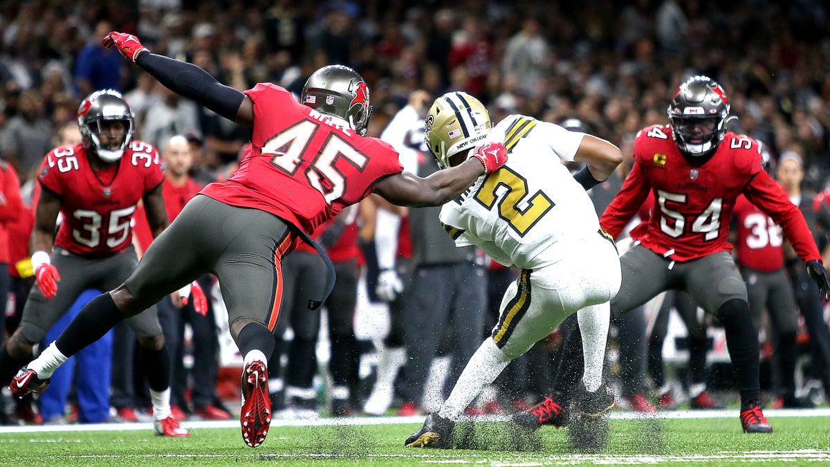 Jameis Winston of the New Orleans Saints is tackled by Devin White of the Tampa Bay Buccaneers at Caesars Superdome on Oct. 31, 2021, in New Orleans, Louisiana.