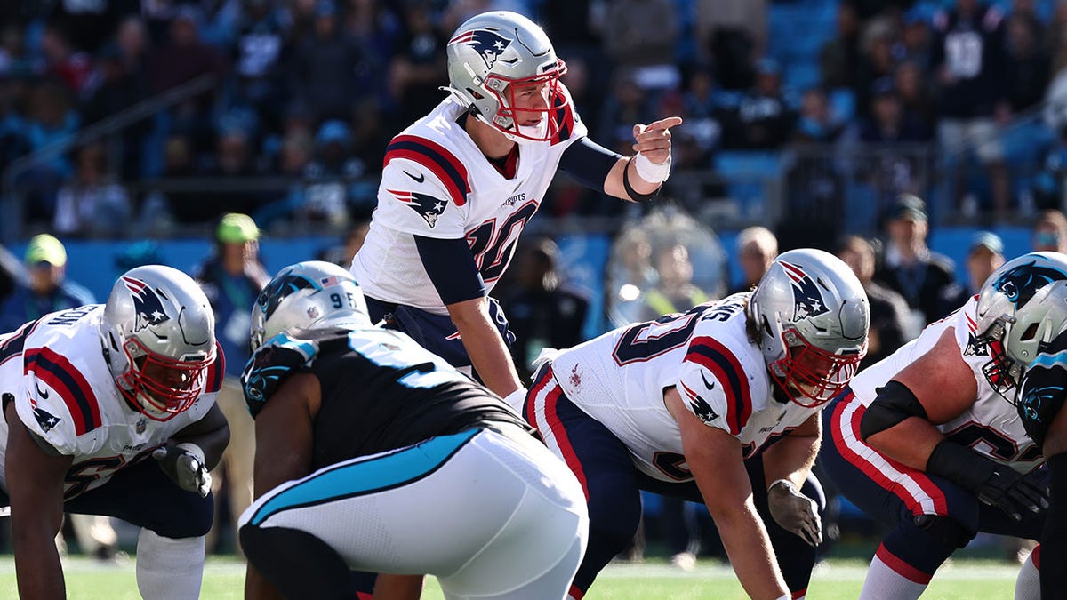 Mac Jones (10) of the New England Patriots under center during the second quarter against the Carolina Panthers at Bank of America Stadium on Nov. 7, 2021 in Charlotte, N.C.