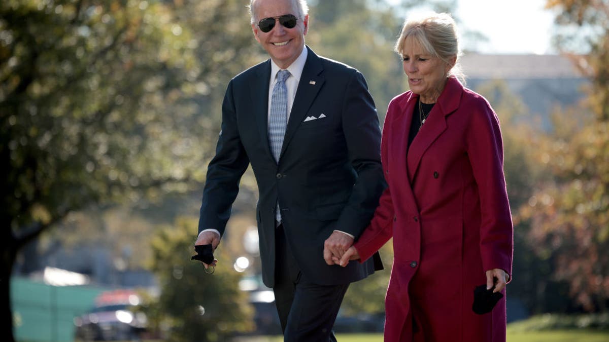 President Joe Biden and first lady Jill Biden return to the White House on Nov. 8, 2021, in Washington, D.C. (Photo by Win McNamee/Getty Images)