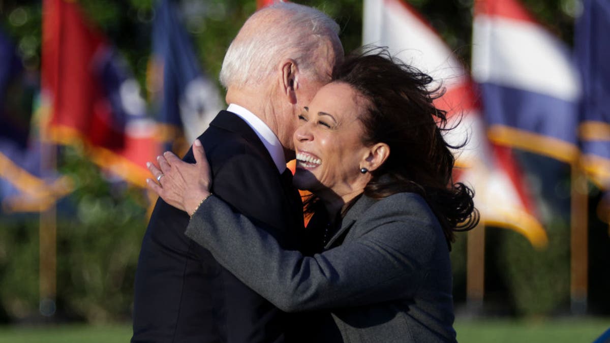 U.S. Vice President Kamala Harris hugs President Joe Biden