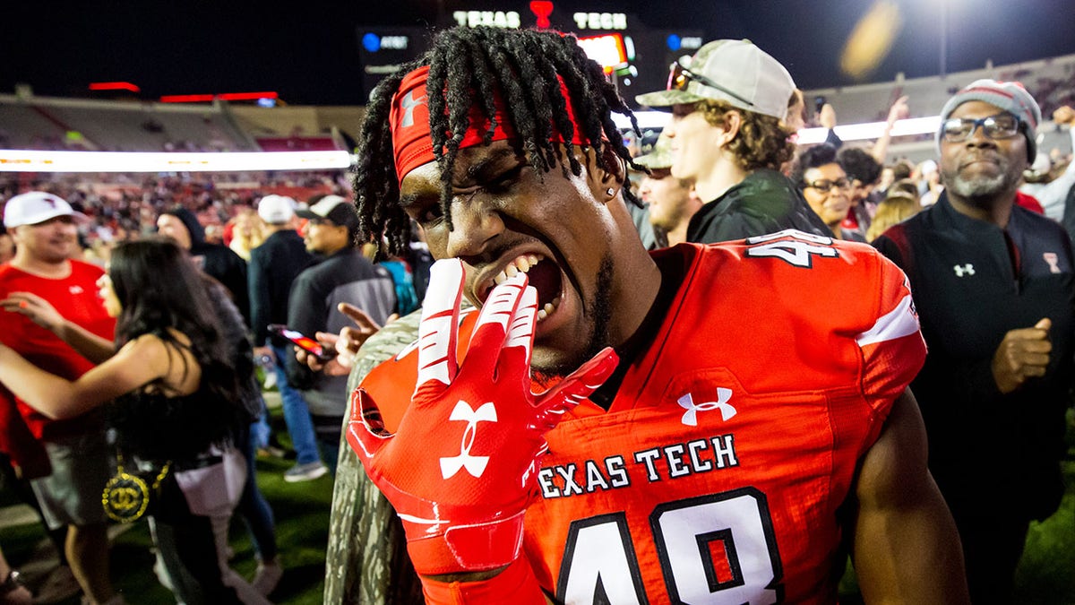 Linebacker Derrick Lewis II of the Texas Tech Red Raiders celebrates after a win against the Iowa State Cyclones Nov. 13, 2021, in Lubbock, Texas.