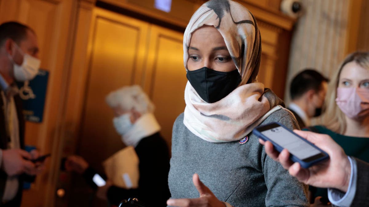 Rep. Ilhan Omar, D-Minn., speaks with a reporter as she leaves the U.S. Capitol Building on Nov. 16, 2021, in Washington, D.C. 