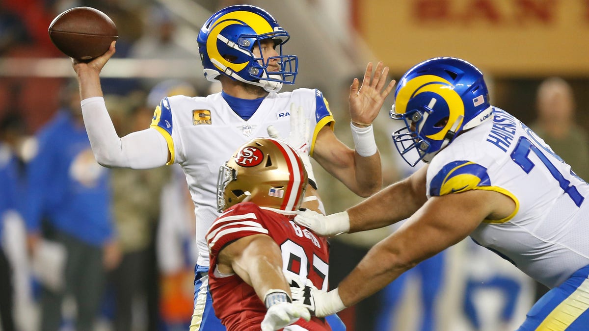 Matthew Stafford (9) of the Los Angeles Rams is pressured by Nick Bosa (97) of the San Francisco 49ers in the fourth quarter against the Los Angeles Rams at Levi's Stadium on Nov. 15, 2021, in Santa Clara, California.