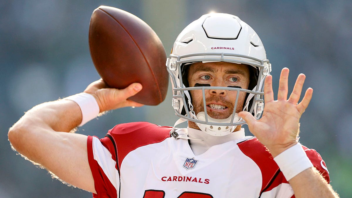 Colt McCoy (12) of the Arizona Cardinals warms up before the game against the Seattle Seahawks at Lumen Field on Nov. 21, 2021, in Seattle, Washington.