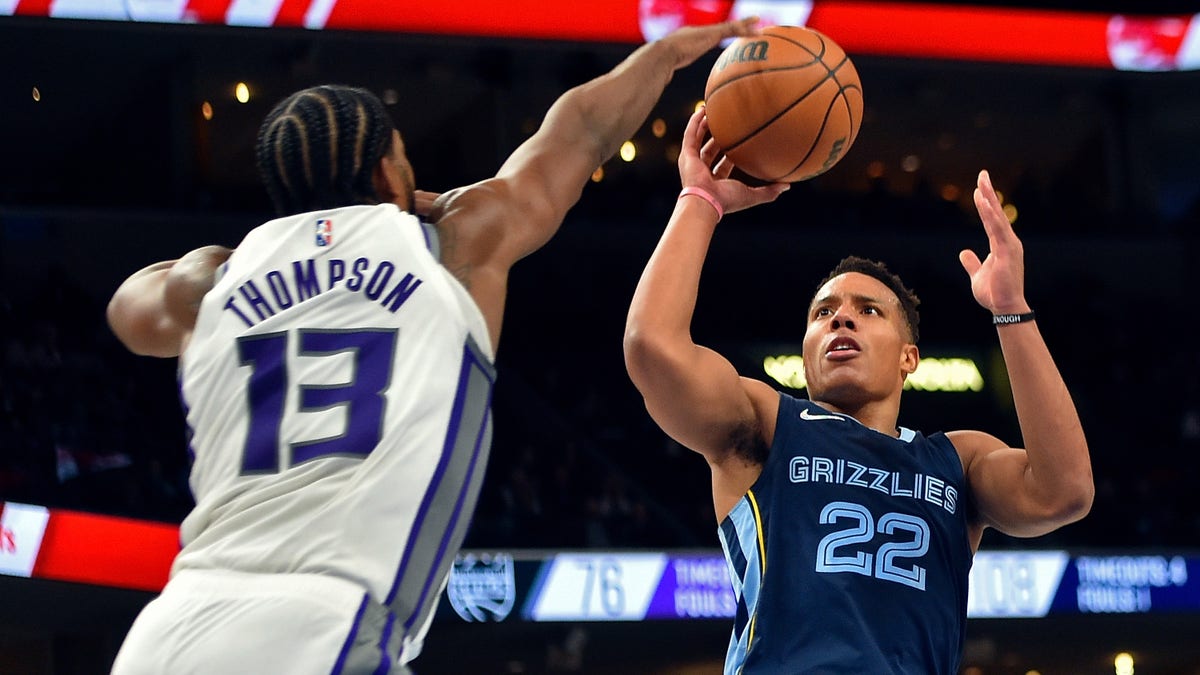 MEMPHIS, TENNESSEE - NOVEMBER 28: Desmond Bane #22 of the Memphis Grizzlies shoots against Tristan Thompson #13 of the Sacramento Kings during the second half at FedExForum on November 28, 2021 in Memphis, Tennessee. 