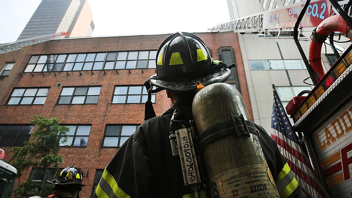 Firefighters put out a fire in a midtown residential building in Manhattan on June 12, 2015 in New York City. (Photo by Spencer Platt/Getty Images)