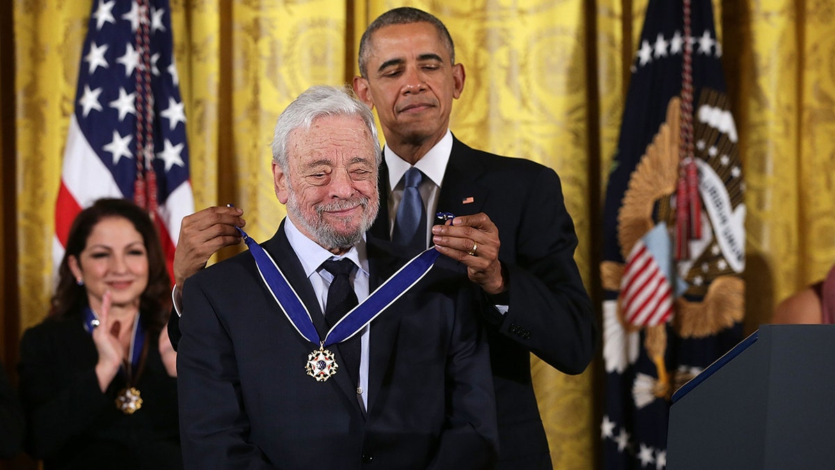 U.S. President Barack Obama presents the Presidential Medal of Freedom to theater composer and lyricist Stephen Sondheim during an East Room ceremony November 24, 2015 at the White House in Washington, DC.