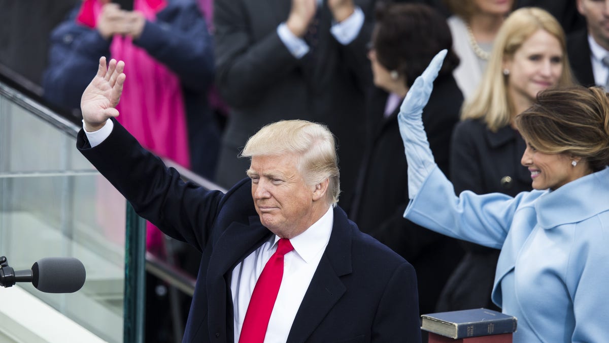 President Trump and first lady Melania Trump wave to the crowds after he was sworn in as the 45th president of the United States, on Jan. 20, 2017. (Samuel Corum/Anadolu Agency/Getty Images)