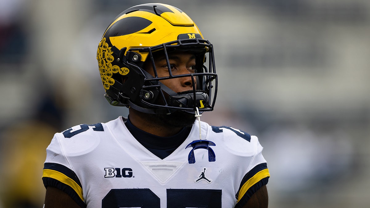 Hassan Haskins of the Michigan Wolverines warms up before the game against the Penn State Nittany Lions at Beaver Stadium on Nov. 13, 2021, in State College, Pennsylvania.