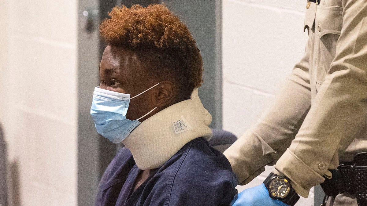 Former Raiders wide receiver Henry Ruggs, accused of DUI resulting in death, is brought into the courtroom during his initial arraignment at the Regional Justice Center, on Wednesday, Nov. 3, 2021, in Las Vegas. Ruggs was involved in the fiery crash early Tuesday that left one person dead.