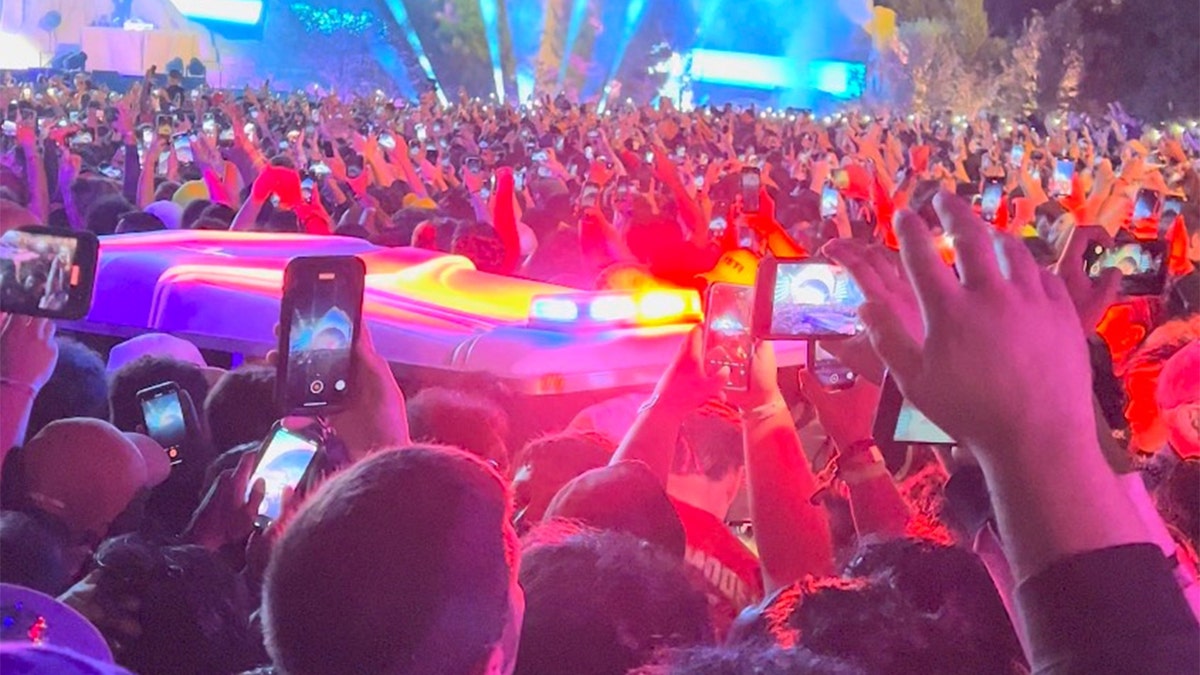 An ambulance is seen in the crowd during the Astroworld music festival in Houston, November 5, 2021 in this still image obtained from a social media video on November 6, 2021.?