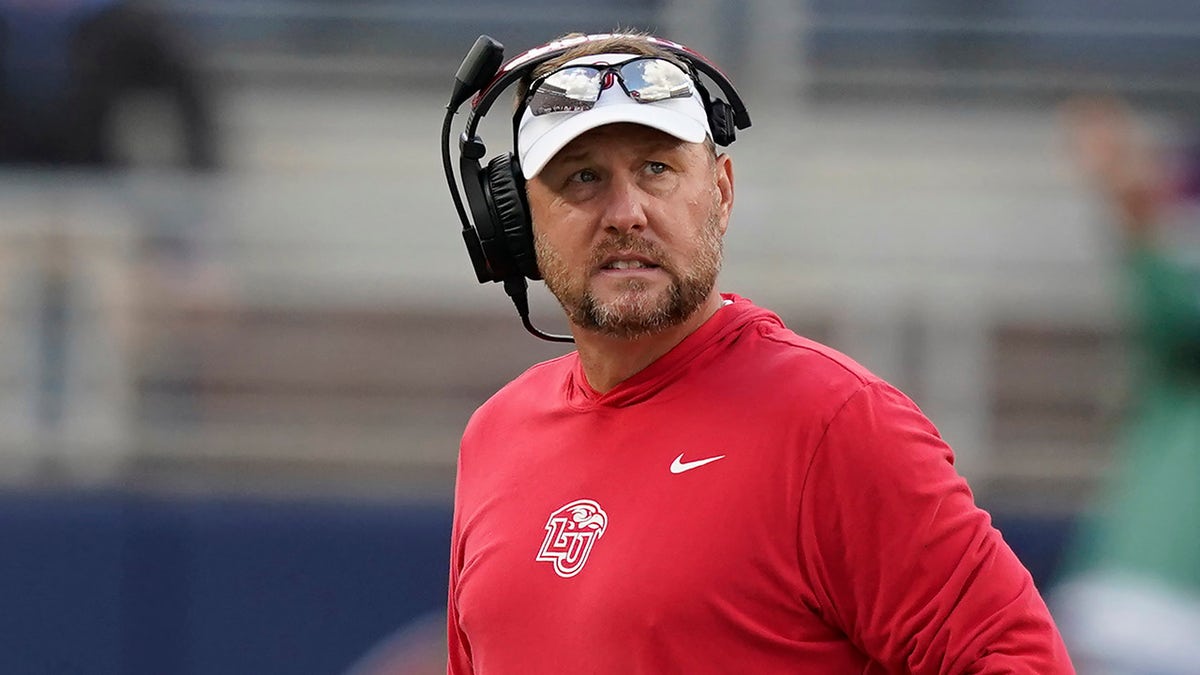 Liberty head coach Hugh Freeze looks towards his team during the second half of an NCAA college football game against Mississippi in Oxford, Miss., Saturday, Nov. 6, 2021. Mississippi won 27-14.