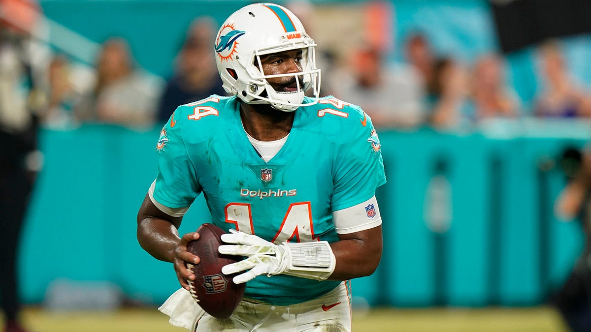 Jacoby Brissett rolls out for the Dolphins
