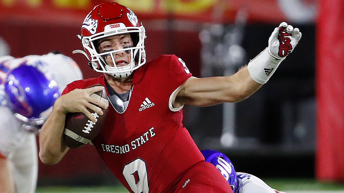 Fresno State quarterback Jake Haener is tackled by a Boise State defender in Fresno, California, on Saturday, Nov. 6, 2021.?