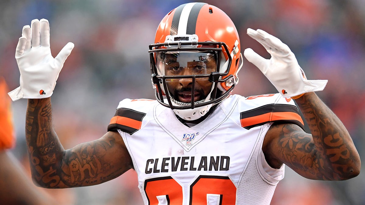 CINCINNATI, OH - DECEMBER 29, 2019: Wide receiver Jarvis Landry #80 of the Cleveland Browns signals touchdown toward an official, after a 20-yard touchdown by wide receiver Odell Beckham Jr. #13 in the fourth quarter of a game against the Cincinnati Bengals on December 29, 2019 at Paul Brown Stadium in Cincinnati, Ohio. Cincinnati won 33-23.