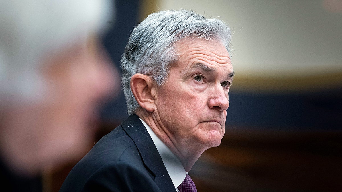Jerome Powell sits at a hearing