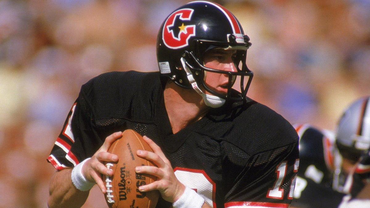 Quarterback Jim Kelly of the Houston Gamblers looks to pass during a United States Football League game in 1984.