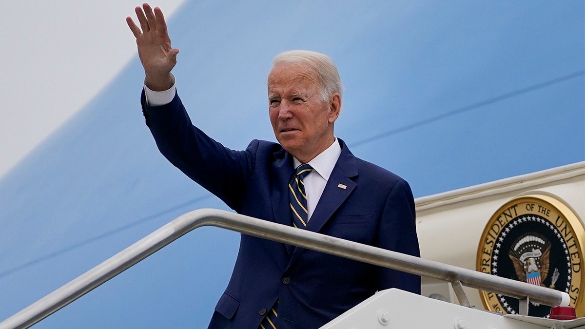 President Biden waves as he boards Air Force One after attending the G20 summit in Rome, Monday, Nov. 1, 2021. (AP Photo/Evan Vucci)