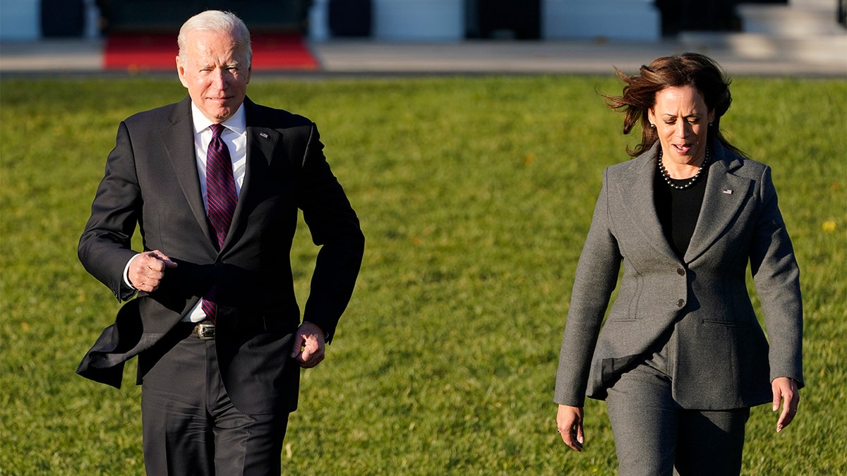 President Biden, with Vice President Kamala Harris, arrives to speak before signing the $1.2 trillion bipartisan infrastructure bill into law during a ceremony on the South Lawn of the White House in Washington, Monday, Nov. 15, 2021.