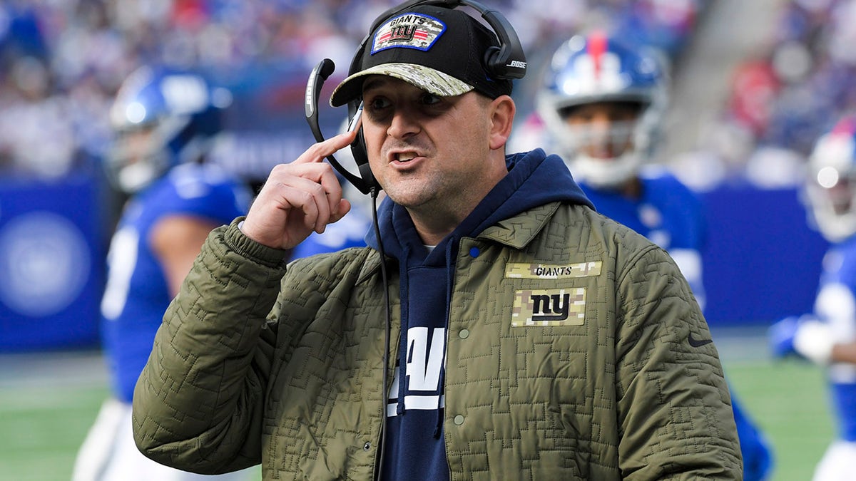 New York Giants head coach Joe Judge talks to players during the first half of an NFL football game against the Las Vegas Raiders, Sunday, Nov. 7, 2021, in East Rutherford, New Jersey.