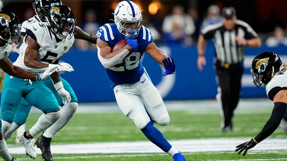 Indianapolis Colts running back Jonathan Taylor (28) runs against the Jacksonville Jaguars in the first half of an NFL football game in Indianapolis, Sunday, Nov. 14, 2021.