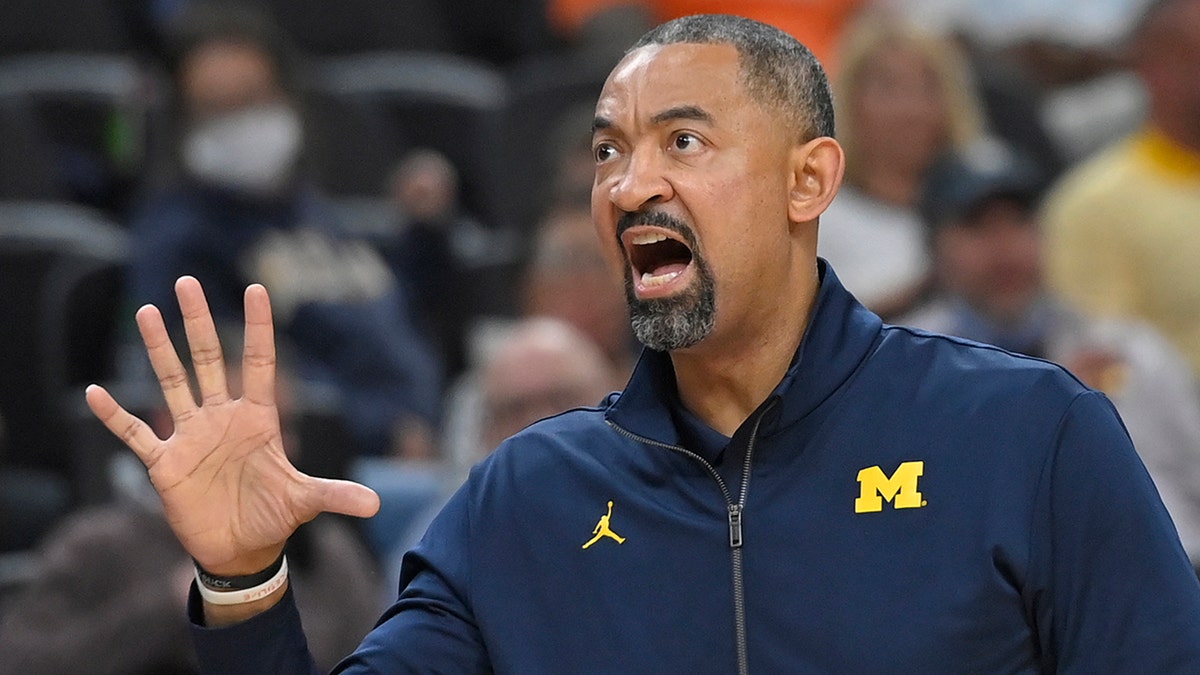 Michigan head coach Juwan Howard calls to his team from the sidelines against UNLV during the second half of an NCAA college basketball game Friday, Nov. 19, 2021, in Las Vegas.