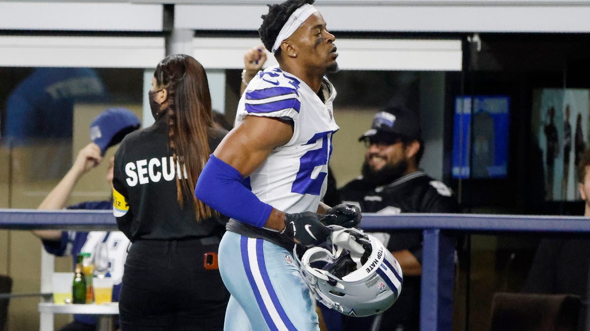 Dallas Cowboys cornerback Kelvin Joseph leaves the field after being ejected following a fight that included Joseph and Las Vegas Raiders' Roderic Teamer in the second half of an NFL football game in Arlington, Texas, Thursday, Nov. 25, 2021. (AP Photo/Michael Ainsworth)